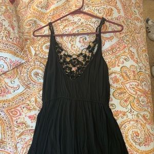 Black LF Romper with gold chain embellishment
